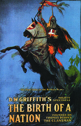 The release poster for The Birth of a Nation depicts a hooded Klansman on a hooded horse; he holds a fiery cross above his head as the horse rears back. The text reads “The Fiery Cross of the Ku Klux Klan / D.W. Griffith’s Mighty Spectacle / The Birth of a Nation / Founded on Thomas Dixon’s ‘The Clansman.’”