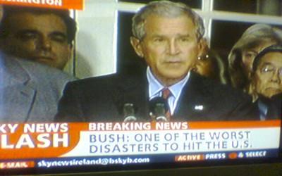 George Bush on the news with the headline