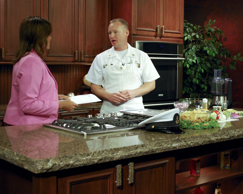 Chief Navy Counselor John Epp performs a cooking demonstration on a local TV station as part of Twin Cities Navy Week. Twin Cities Navy Week is one of 20 Navy Weeks planned across America for 2010. Navy Weeks show Americans the investment they have made in their Navy and increase awareness in cities that do not have a significant Navy presence. (U.S. Navy photo by Mass Communication Specialist 3rd Class Sean Gallagher/Released)