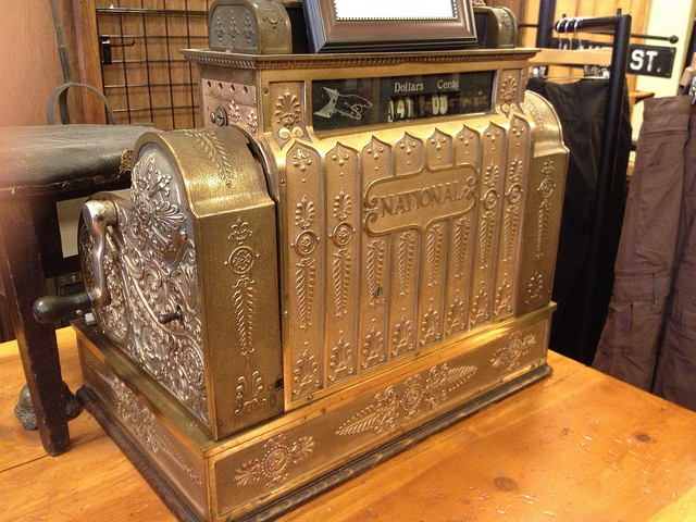 A very old, gold National Cash Register