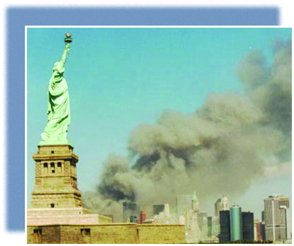 A photograph shows the New York skyline with the Statue of Liberty in the foreground. In the background, massive plumes of smoke rise from the twin towers.